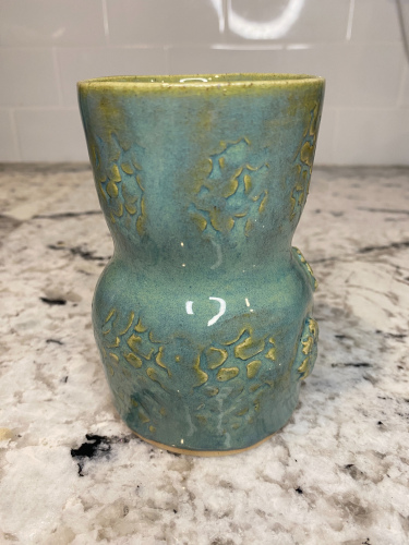 Small green textured vase